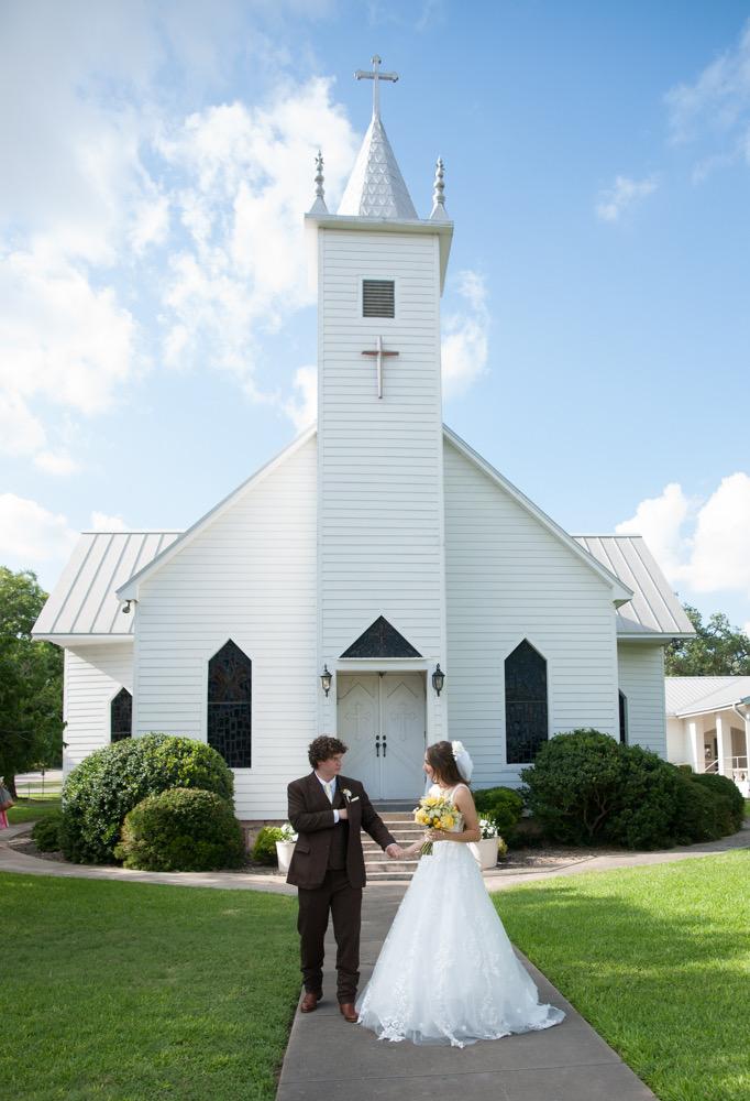 Whitney and Cade chapel wedding floral moment