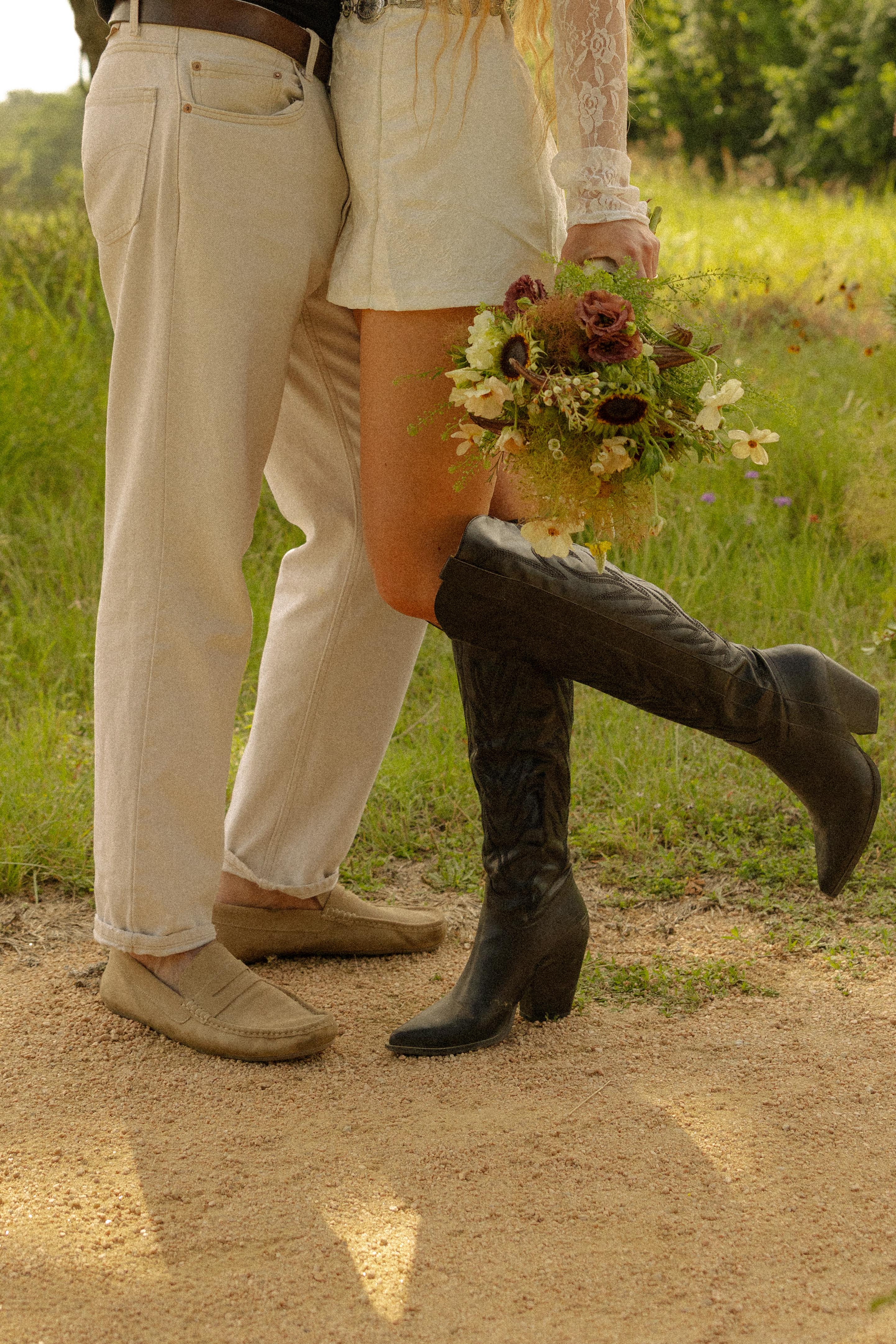Couple waist-down view with bouquet