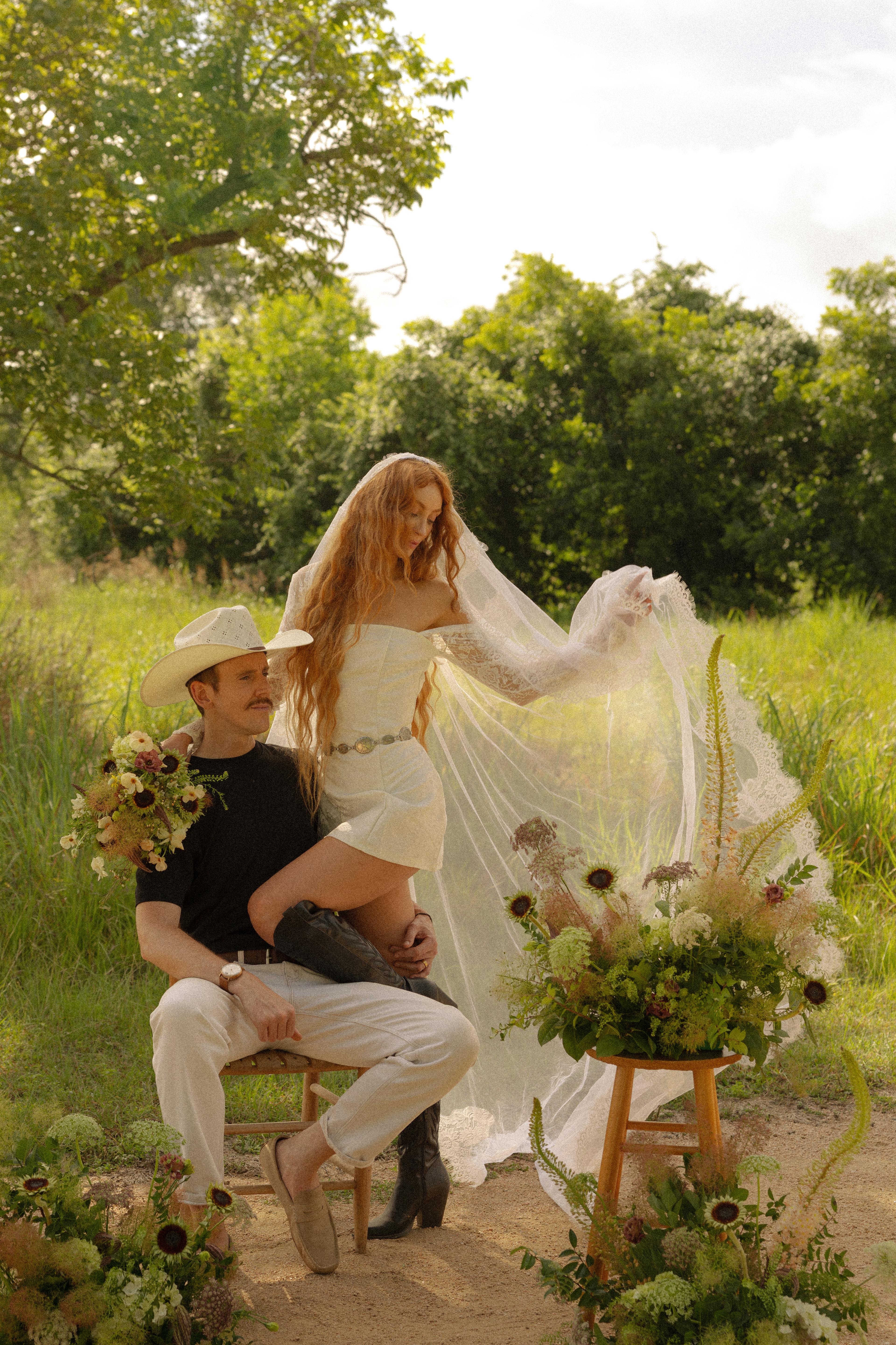 Full view of couple with western floral styling