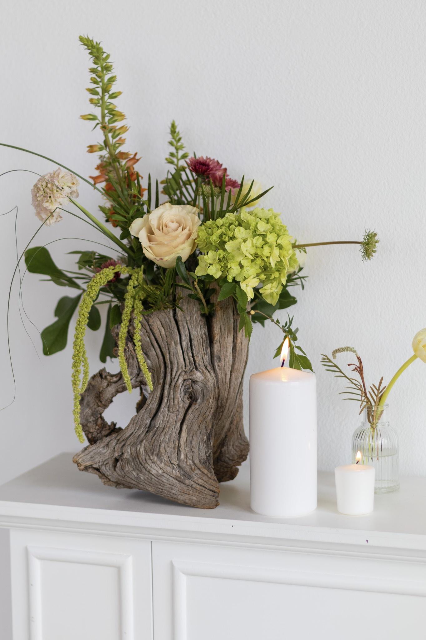 Close-up of floral arrangement in a wooden container